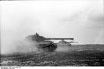 Two German Tiger II heavy tanks with Porsche-built turrets on the move, France, Jun 1944