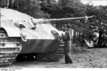 A German Tiger II tank being painted, France, Jun 1944, photo 1 of 3