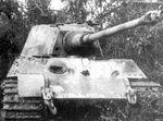Knocked out Tiger II heavy tank, France, Aug 1944; note penetrated frontal turret armor