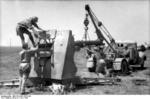German troops changing the barrel of an 8.8 cm FlaK gun, Bir al Hakim, Tunisia, North Africa, Jun 1942