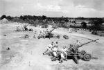 British Royal Marines drilling with three 40-mm Bofors guns at the Royal Marine Group Mobile Naval Base Defence Organisation Instructional Wing, Chatham Camp, Colombo, Ceylon, Sep 1943