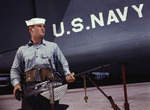 US Navy sailor J. D. Estes posing with a Browning M2 machine gun, Corpus Christi, Texas, United States, Aug 1942