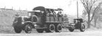 155 mm Howitzer Carriage M1917 or M1918 howitzer being towed in the United States, date unknown