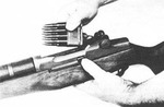 Unloading an eight-round ammunition clip from an M1 Garand rifle, date unknown
