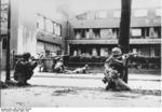 Soldiers of 44th Division, US 7th Army fighting in Mannheim, Germany, 29 Mar 1945; note bazooka and M1 Garand rifles