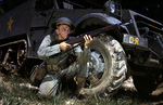 US Army soldier posing with his M1 Garand rifle next to a M3 halftrack, Fort Knox, Kentucky, United States, Jun 1942, photo 2 of 4