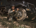 US Army soldier posing with his M1 Garand rifle next to a M3 halftrack, Fort Knox, Kentucky, United States, Jun 1942, photo 3 of 4