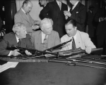 US Senator Morris Sheppard, Major General George Lynch, and Senator A. B. Chandler comparing M1941 Johnson rifles and the M1 Garand rifles, Washington, DC, United States, 29 May 1940