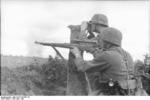 A German sniper (carrying Kar98k with 4x Zeiss ZF42 telescopic sight) and a spotter at Voronezh, Russia, Jun-Jul 1942