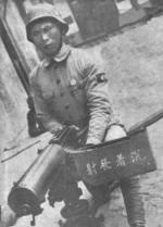 Chinese soldier posing with a Type 24 machine gun, China, circa late 1930s