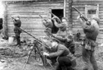 Soviet troops posing with PPSh-41 submachine guns and a captured German MG34 machine gun, date unknown