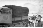 German troops and artillery tractor in wintry terrain, early 1944, photo 2 of 2; note MP 40 submachine gun