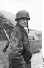 German paratrooper with MP 40 submachine gun, France, summer 1944