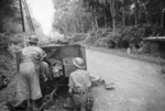 2 pounder gun of 4th Anti-Tank Regiment of Australian 8th Division on the Muar-Parit Sulong Road, Malaya, 18 Jan 1942; note knocked out Japanese Type 95 Ha-Go tank in distance