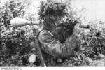 Camouflaged German paratrooper with Panzerfaust, France, Jun-Jul 1944