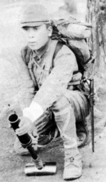 Japanese soldier posing with a Type 89 grenade launcher, date unknown