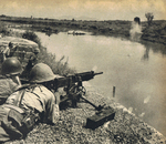 Machine gun crew of Japanese 4th Division near Miluo River in Hunan Province, China, during Second Battle of Changsha, 22 or 23 Sep 1941