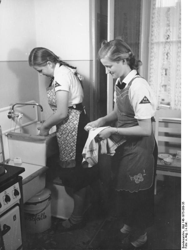 Members of the League of German Girls cleaning a shared kitchen, date unknown