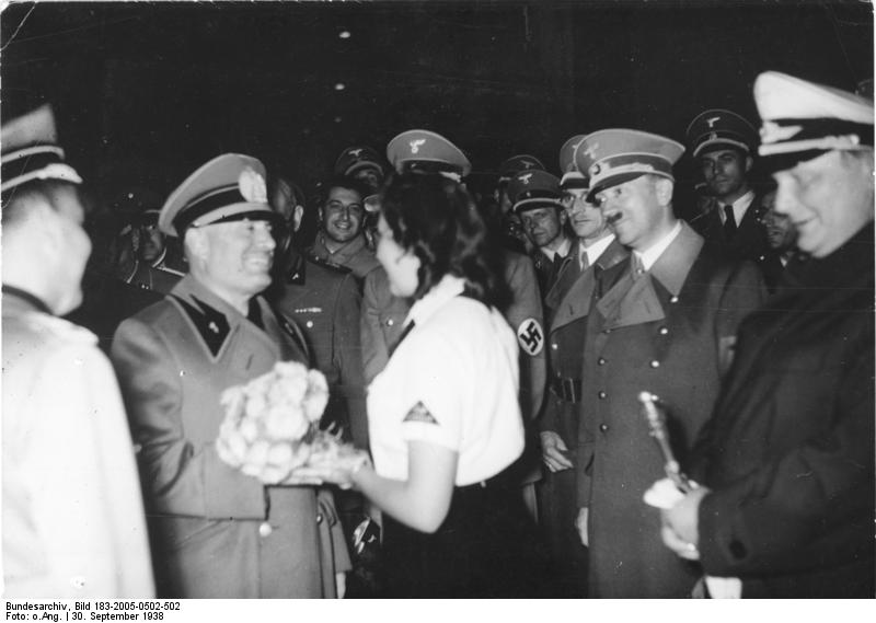 Benito Mussolini receiving flowers from a member of the League of German Girls, Munich, Germany, 30 Sep 1938