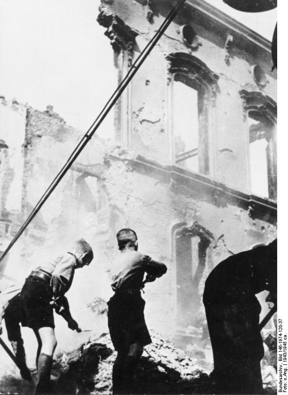 Hitler Youth members cleaning a bomb-damaged building in Germany, 1943-1945