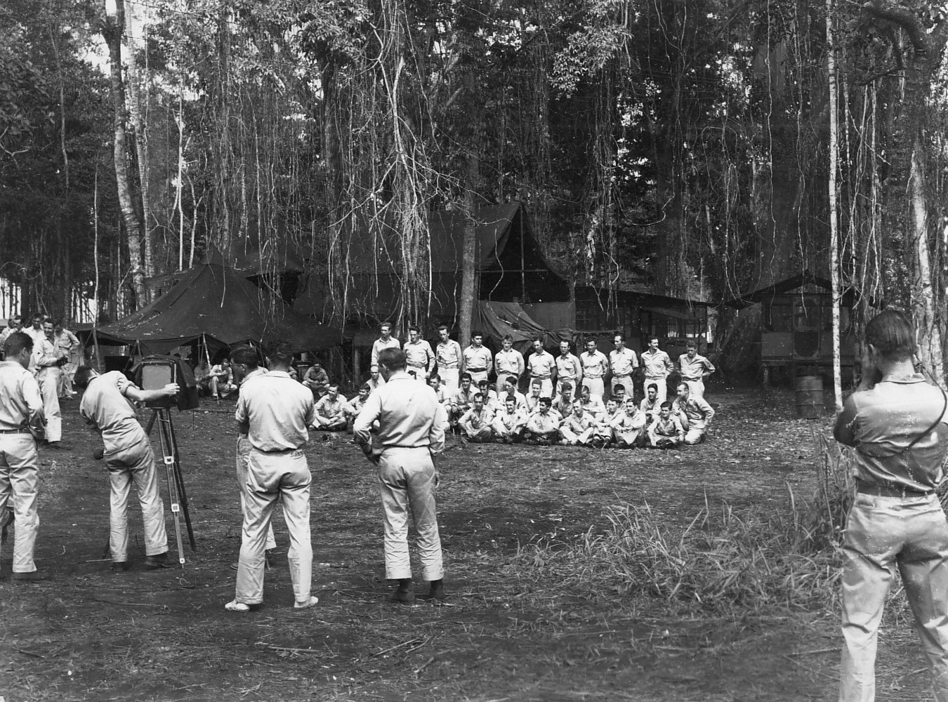 Preparing for a group shot of the airmen of 13th Bomb Squadron of USAAF 3rd Bomb Group, Dobodura Airfield, Australian Papua, mid-1943
