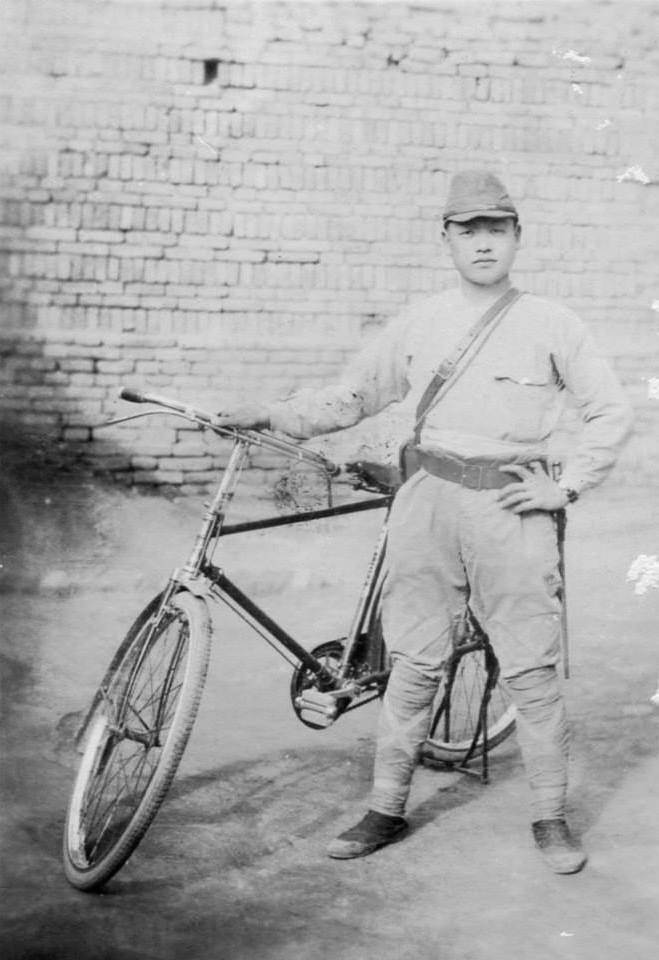 Japanese Army soldier with bicycle, circa 1940s