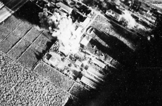 Carrier aircraft of Task Force 38 attacking the Japanese Army airfield at Takao (now Kaohsiung), Taiwan, 12 Oct 1944, photo 3 of 4; US intelligence referred to this field as 'Reigaryo Airfield'