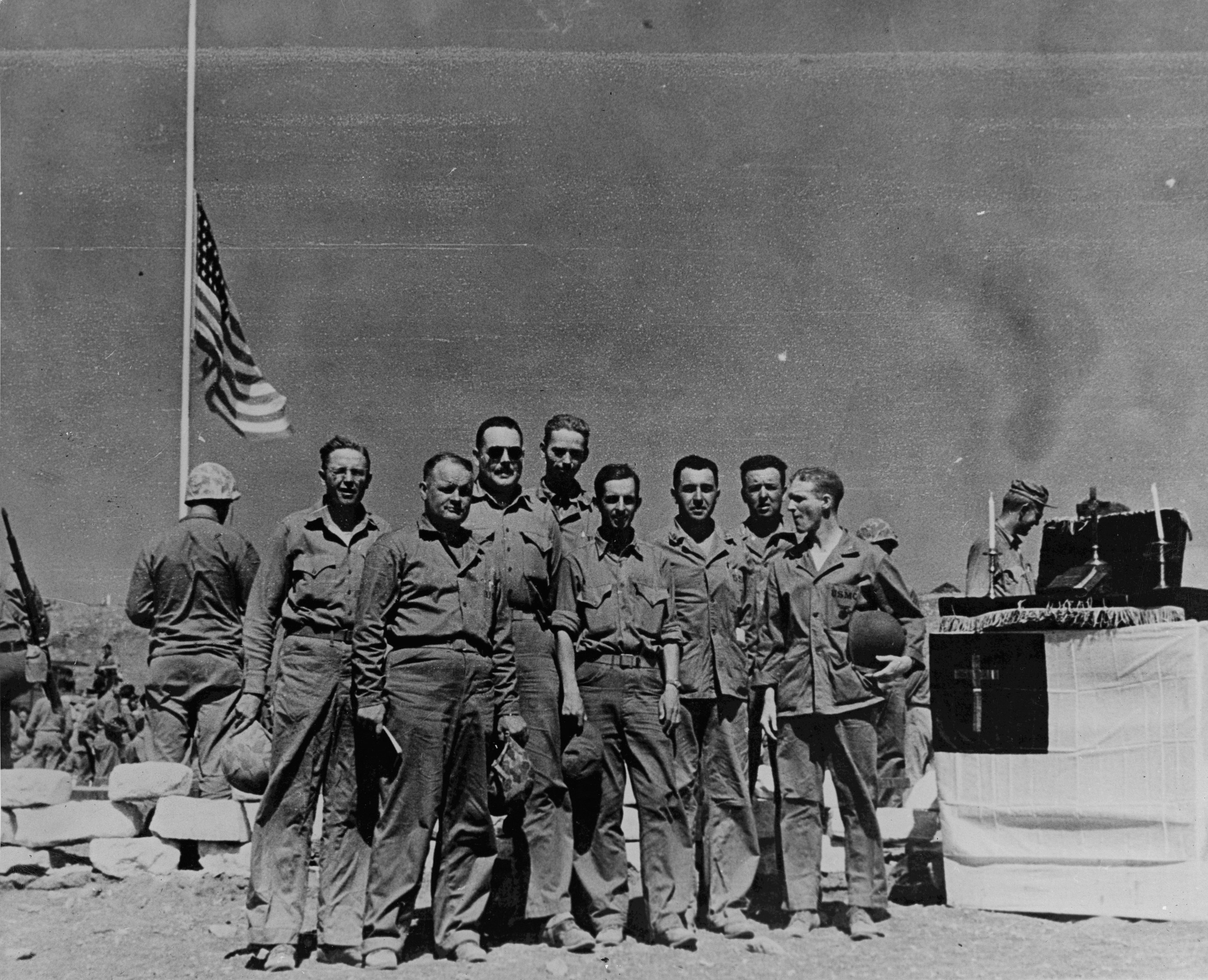 Chaplains Strum, Sartelle, Sneary, Barney, Hoatling, John Craven, Singer, and Wood of US 4th Marine Division at the division's cemetery on Iwo Jima, Japan, Mar 1945
