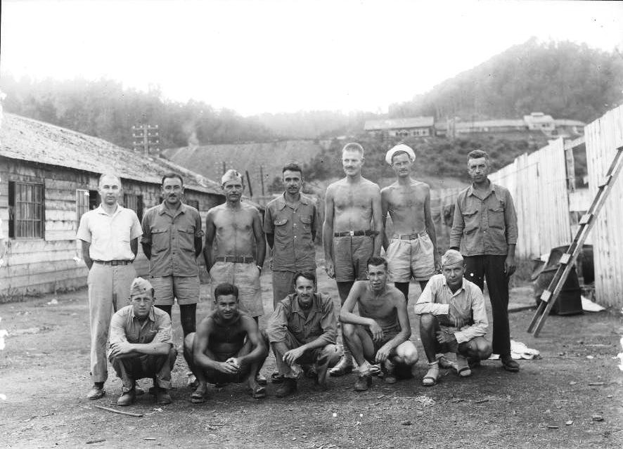 US Marine Captain J. R. Hester (back row, 4th from left) and other American prisoners of war, Hokkaido, Japan, circa 1943