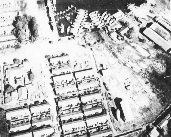 Aerial reconnaissance photo of facilities at Takao naval base, Taiwan, 13 Oct 1944, photo 1 of 2; note barrage balloon