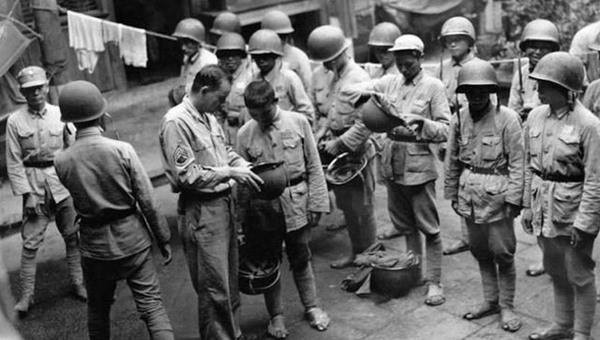 Chinese recruits receiving US military equipment, China, 1940s