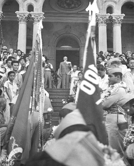 Governor of Hawaii Ingram Stainback speaking to returning Japanese-American veterans of US 442nd Regimental combat Team from the steps of the Iolani Palace, Honolulu, US Territory of Hawaii, 9 Aug 194