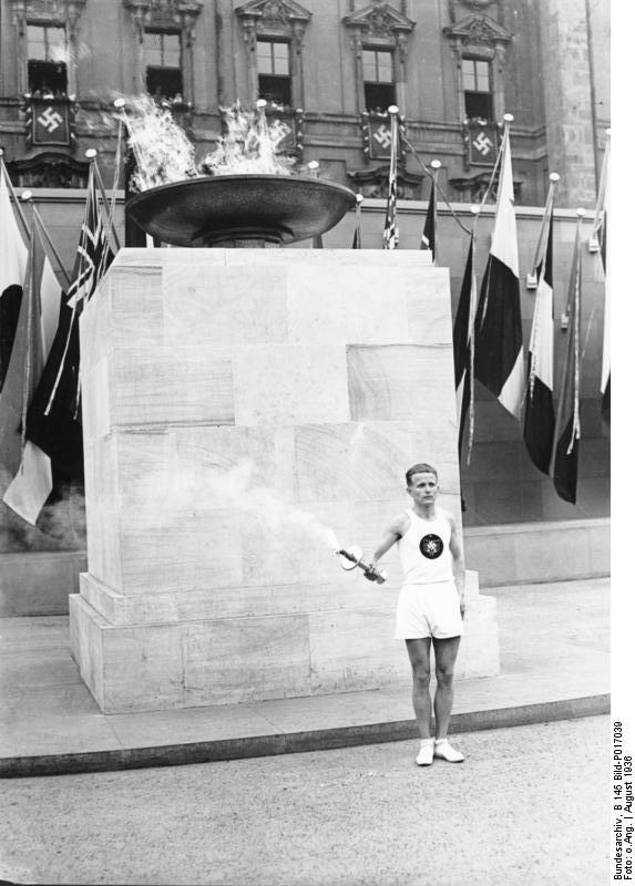 German runner with the Olympic flame at the Lustgarten, Berlin, Germany, Aug 1936