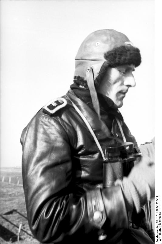 Tank commander of German 12th SS Panzer Division 'Hitlerjugend' in Belgium or France, 1943; note leather cap, leather jacket, and binoculars