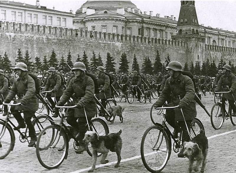 Soviet bicycle troops with war dogs on parade, Moscow, Russia, 1 May 1938