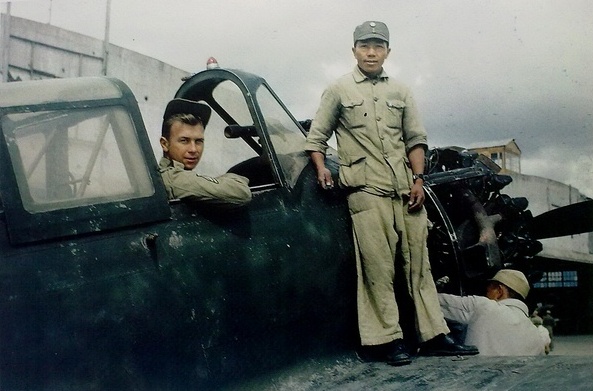 American and Chinese airmen inspecting a captured Japanese aircraft, 1945-1946