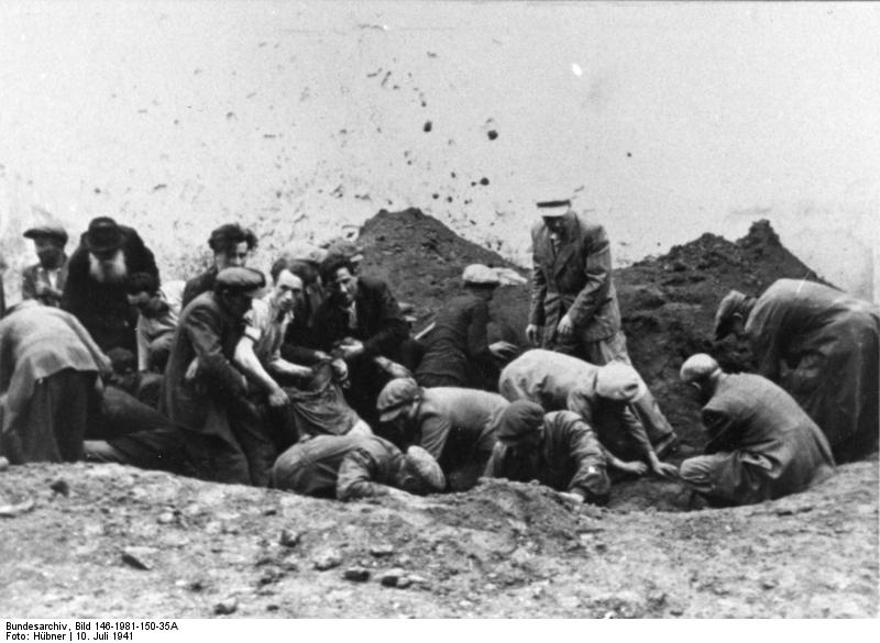 Civilians exhuming a mass grave containing victim of the Soviets, Tarnopol, Poland (now Ternopil, Ukraine), 10 Jul 1941