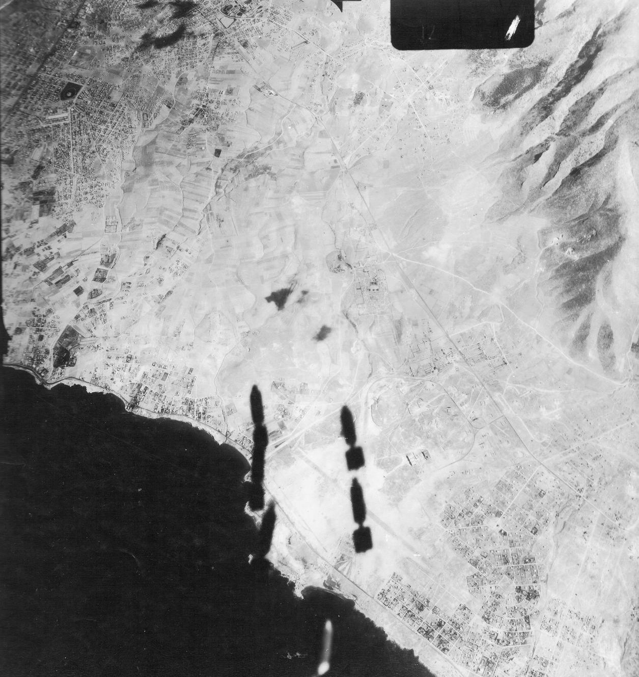 Bombing of Kalamaki Airfield, Athens, Greece, seen from the bomb bay of a US B-17 bomber, 15 Sep 1944