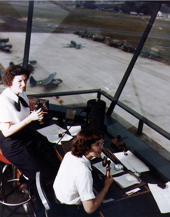 WAVES Specialist (T) 3rd Class Dorothy Knee and Specialist (T) Genevieve Close directing air traffic at Naval Air Station, Anacostia, District of Columbia, United States, in early or mid-1943