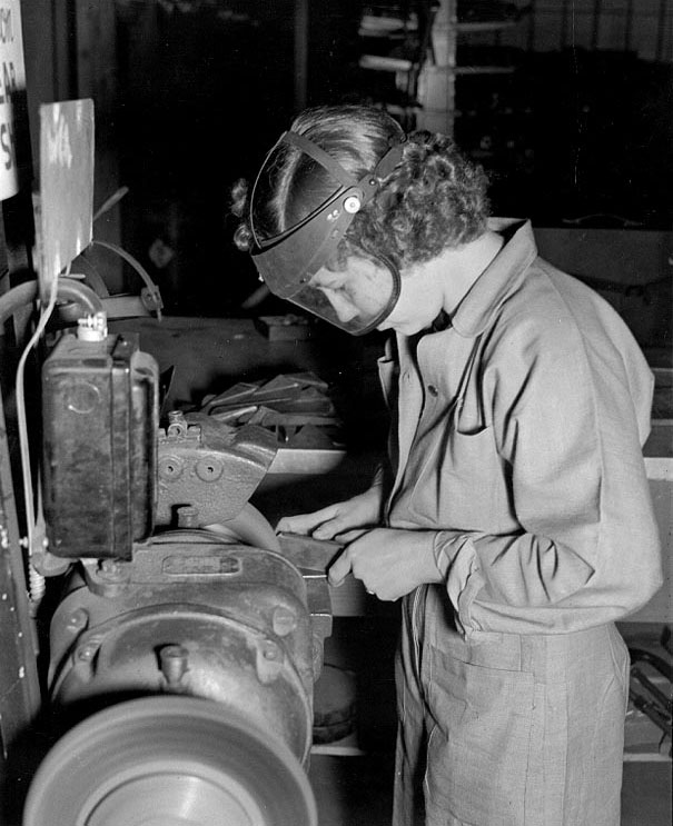 WAVES Aviation Metalsmith 3rd Class Robie Young working at a grinder in the Assembly and Repair Department, Naval Air Station, Seattle, Washington, United States, circa 1943