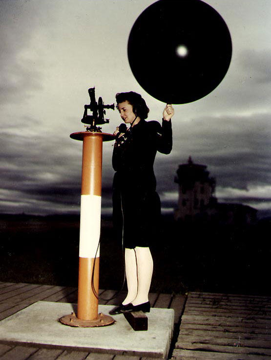 WAVES Aerographer's Mate 3rd Class Dorothy J. Baroch launching a weather balloon rom a theodolite platform, Naval Air Station, Moffett Field, California, United States, circa 1944-1945