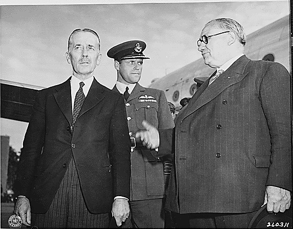 Sir Alexander Cadogan, Group Captain D. M. Somerville, and Ernest Bevin arriving at Gatow Airport in Berlin, Germany to attend the Potsdam Conference, 28 Jul 1945