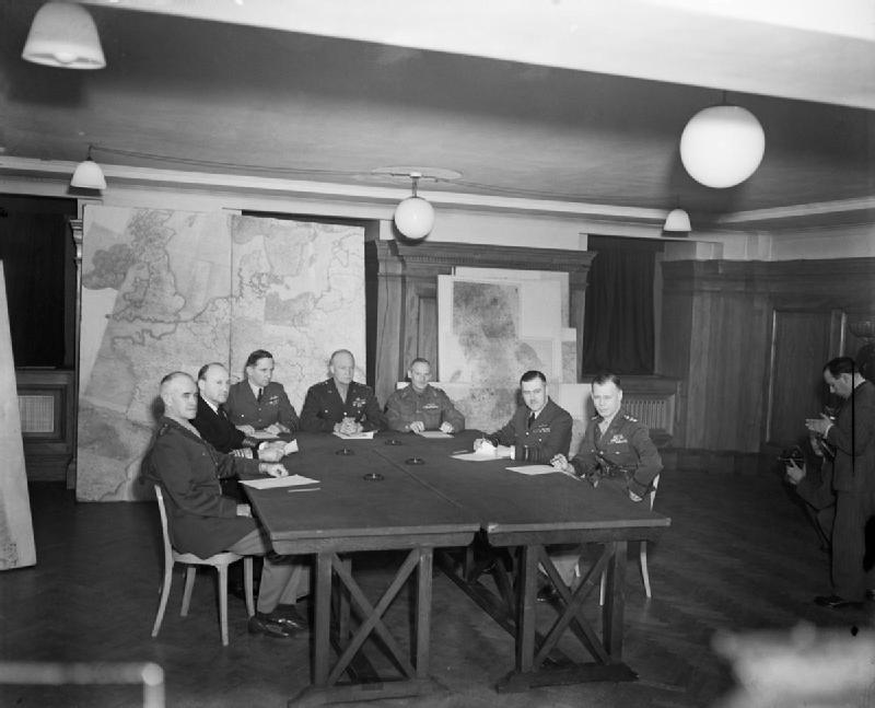 Bradley, Ramsay, Tedder, Eisenhower, Montgomery, Leigh-Mallory, and Smith at a SHAEF conference in London, England, United Kingdom, 1 Feb 1944, photo 2 of 7