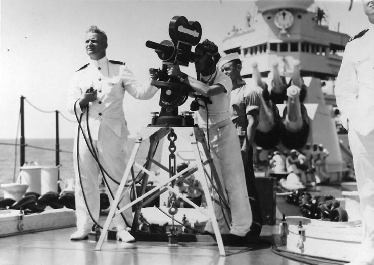 Lieutenant Burke recording gunnery results with a motion picture camera aboard a New Orleans-class heavy cruiser, circa 1934-1935