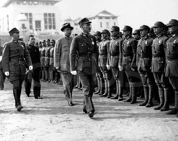Chiang Kaishek reviewing troops at the National Wuhan University, Wuhan, Hubei Province, China, 17 Dec 1937