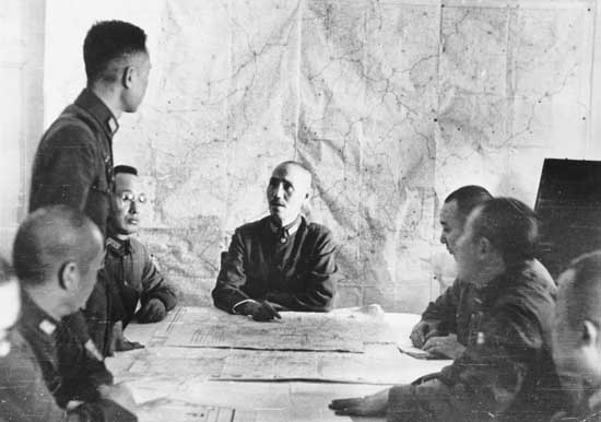 Chiang Kaishek at a military planning session, circa 1938-1940; note He Yingqin to Chiang's right