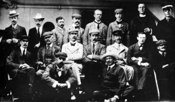 Winston Churchill (center row, 2nd from right) aboard the ship Dunottar Castle, returning from the Boer War, Jul 1900; note Major Frederick Russell Burnham standing in rear row, 3rd from left