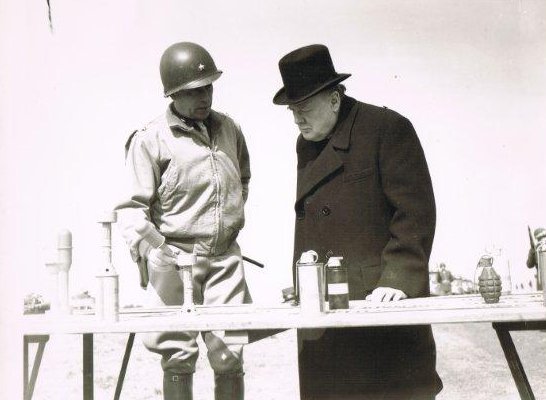 Winston Churchill being shown various weapons, England, United Kingdom, 15 May 1944, photo 2 of 2