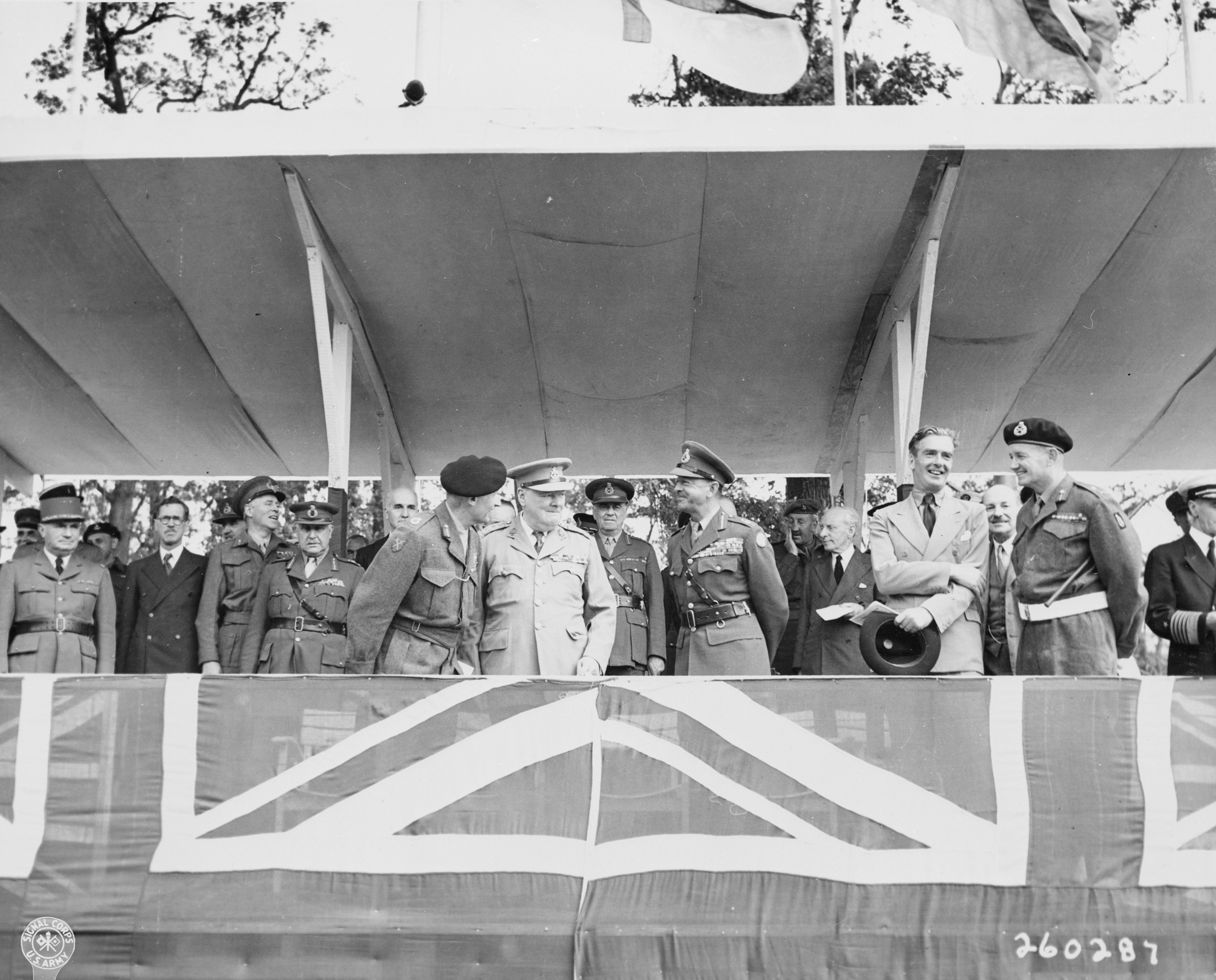 Bernard Montgomery, Winston Churchill, Harold Alexander, and Anthony Eden at the Charlottenberger Chausce reviewing stand during the Berlin victory parade, Germany, 21 Jul 1945