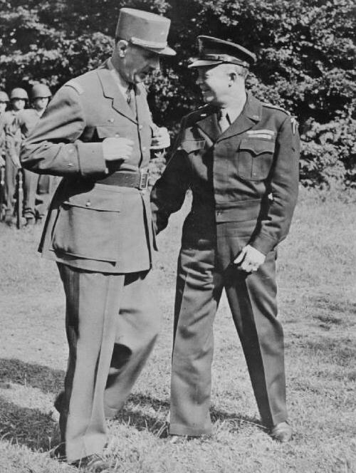 General Charles de Gaulle talking with General Dwight Eisenhower during an inspection of US troops at Eisenhower's headquarters in France, 21 Aug 1944